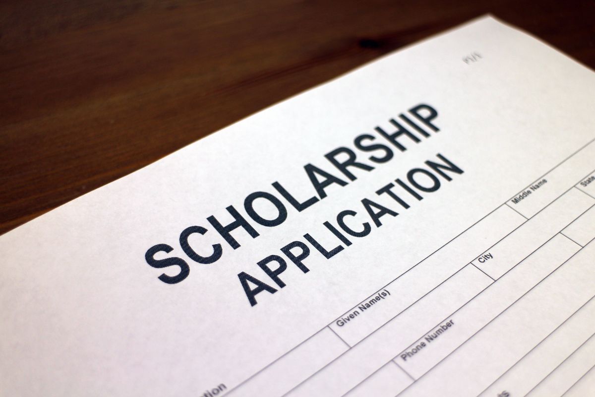 The photo shows a piece of paper with notes referring to support that comes in many forms by encouraging them to apply for scholarships that can make a big difference.