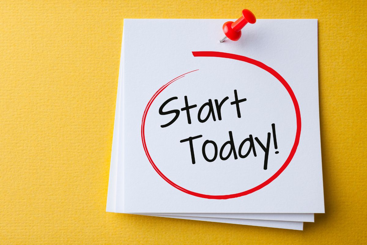 The photo tells about papers with notes and pinned on the wall referring to start today by identifying one small financial action that can lead to bigger financial success.