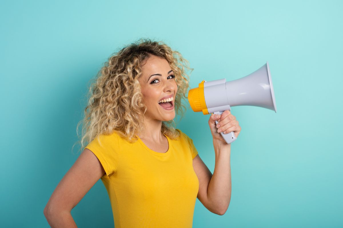 The picture shows a woman speaking in a positive way.