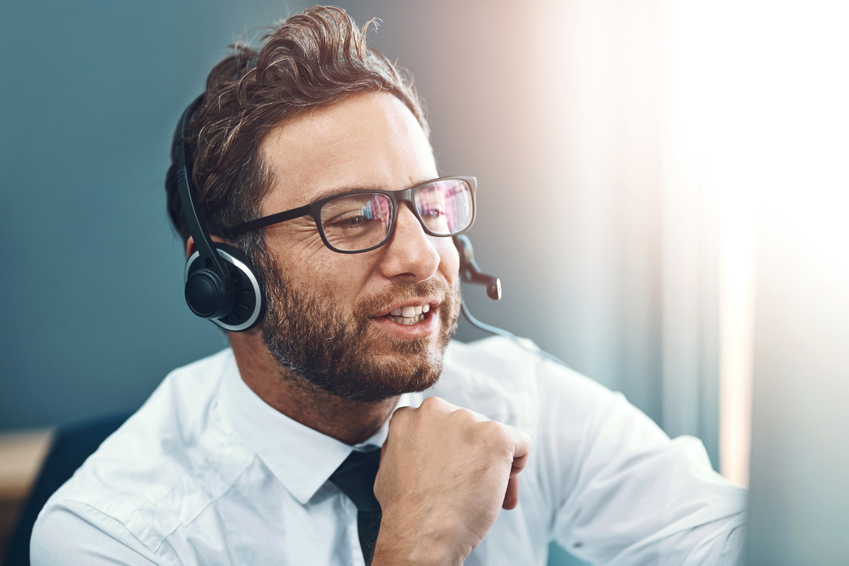 The image tells about a man using a computer while having a face time online which refers to business consultants help companies improve their processes and grow and could be a good way to make money online.