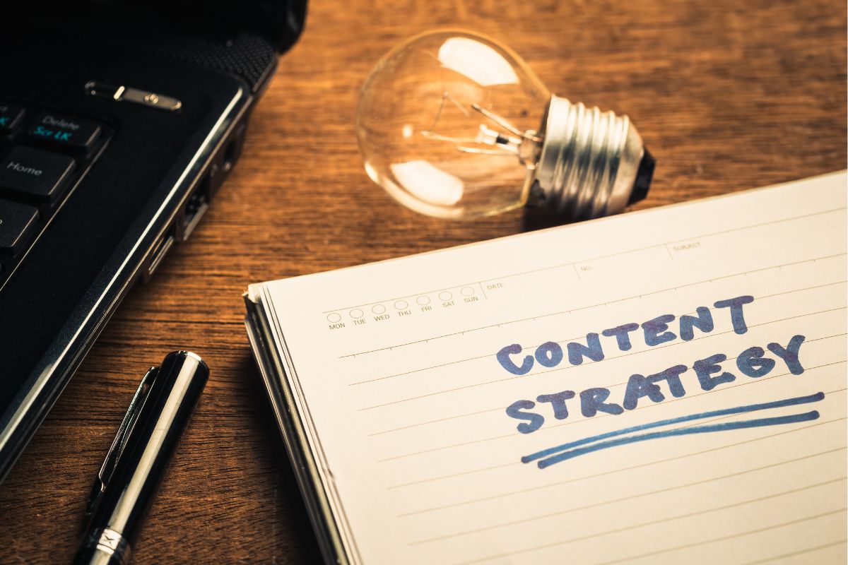 The photo of a notebook with content strategy wording.