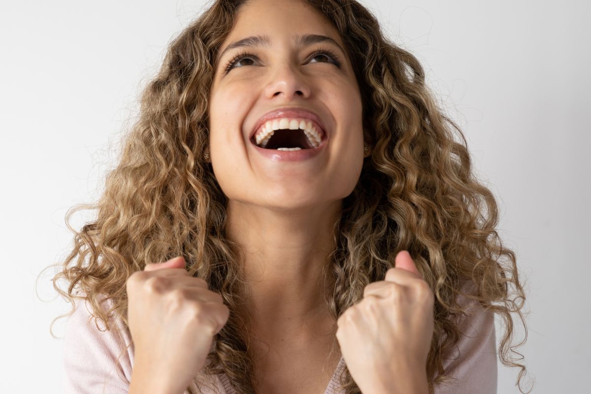 An image of a woman happy with her accomplishment.