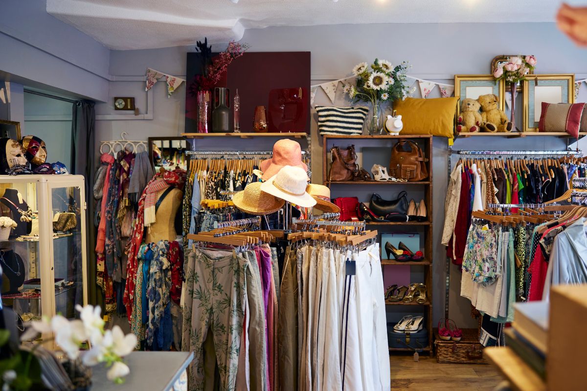 An image of clothes in a thrift store.