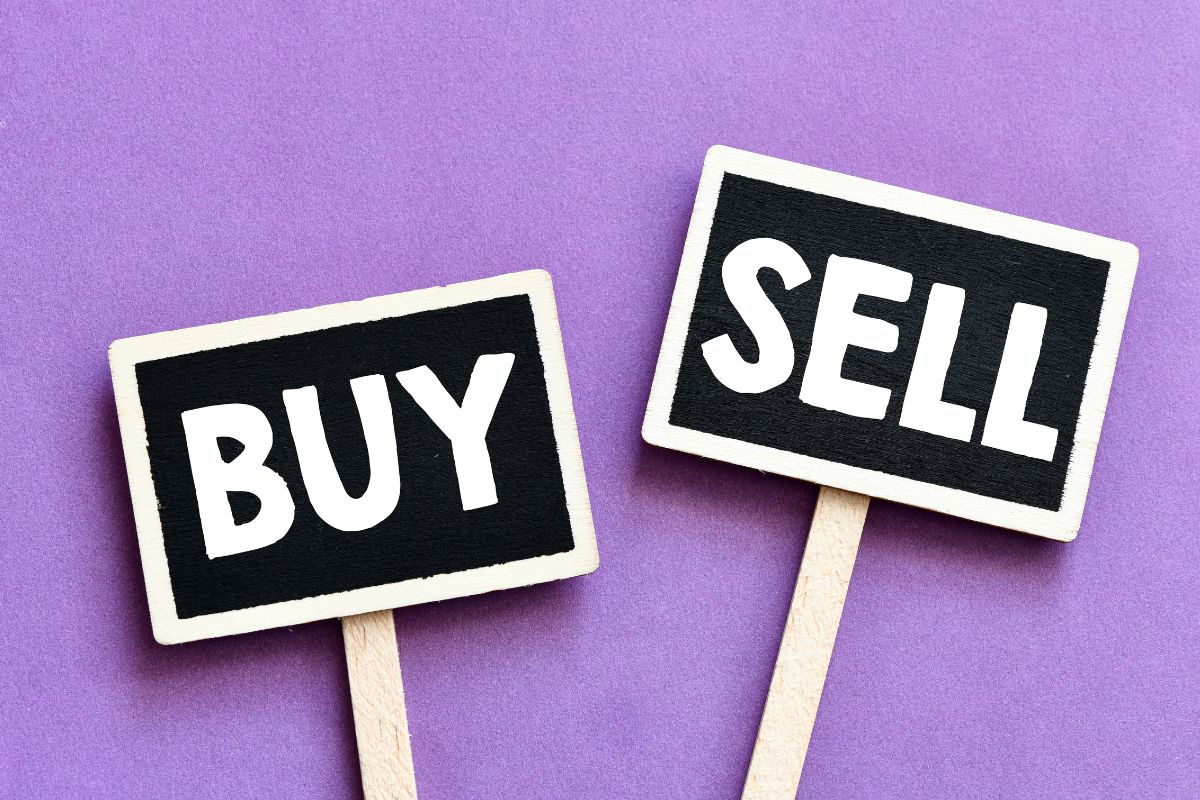 The picture shows the board with notes referring to buying low and selling high means more profit with each scale.