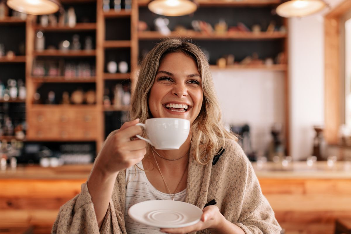 The image shows a woman rewarding herself with coffee.