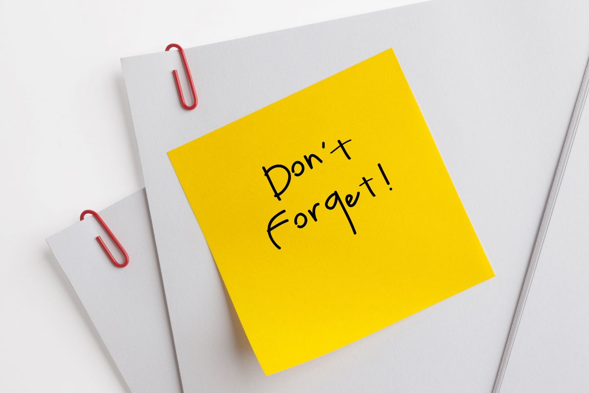 The image shows papers with clips and a sticker note with notes referring to remind yourself of the benefits of having more control over your future and helping you stay on track.