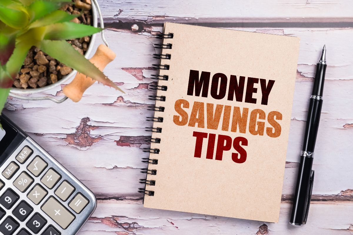 The picture tells about a plant, a calculator, a pen, and a notebook with notes indicating to pick a money-saving challenge to get started to help you stay on track and make saving a habit.