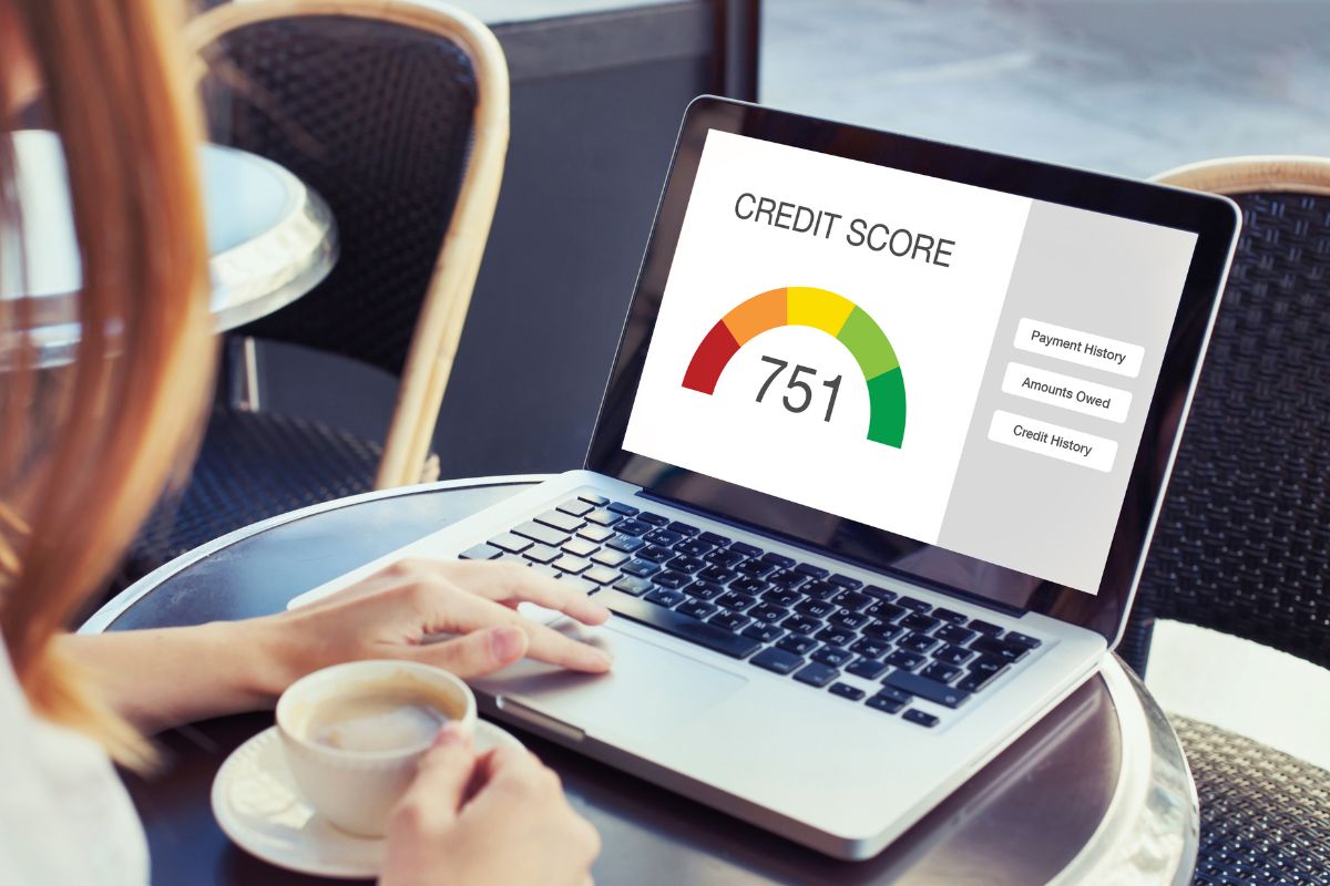 A picture of a woman checking her credit score.