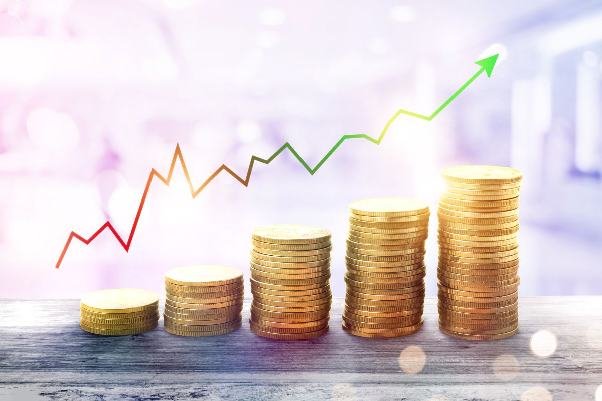 The image of coin stocks and the increasing arrow referring to paying off debt enhances the ability to invest and grow wealth and build a strong financial future.