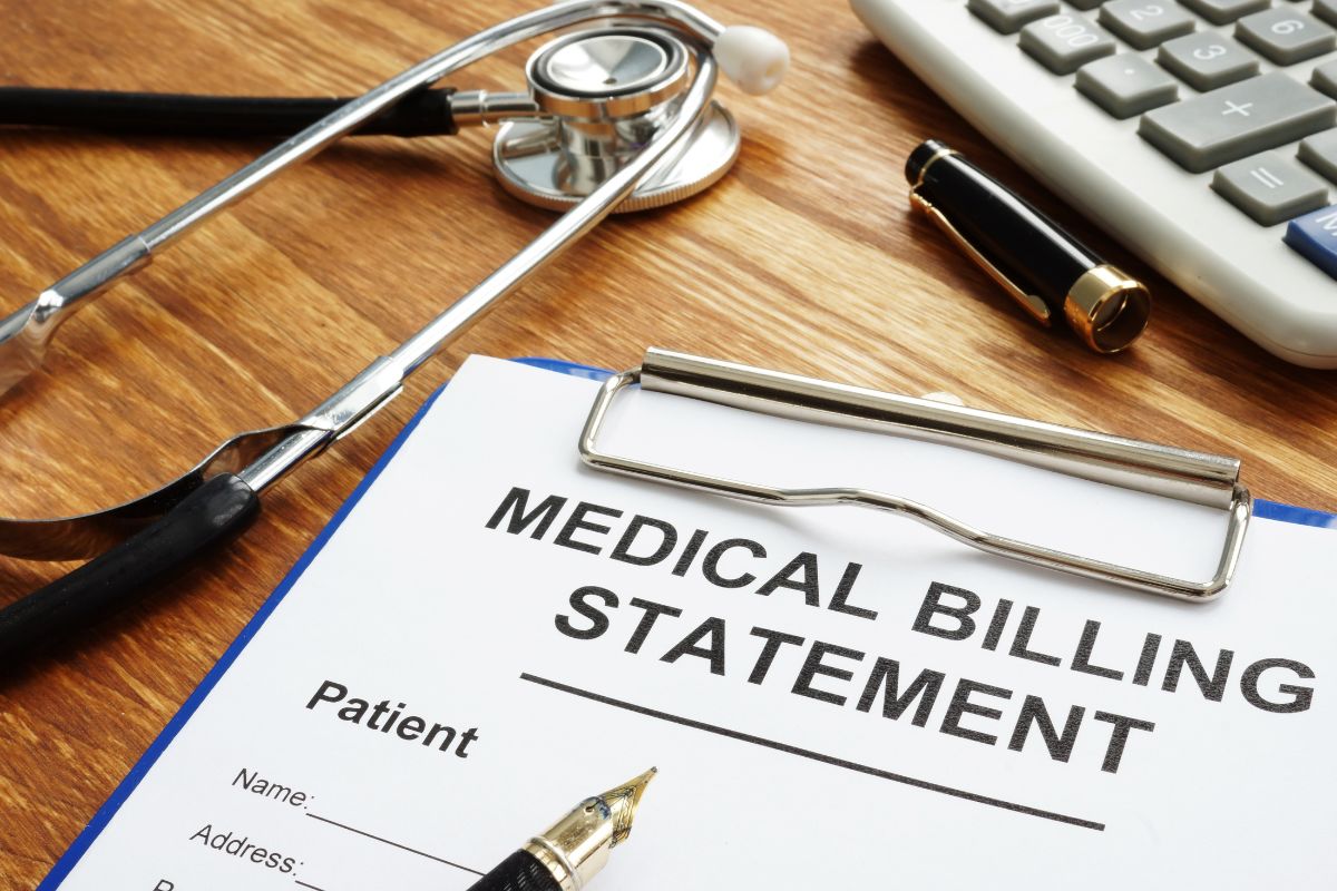 The picture tells about a stethoscope, a calculator, a pen, and a clipboard with notes referring to paying off debt reduces the risk and vulnerability to financial emergencies and protects you from falling deeper into financial trouble.