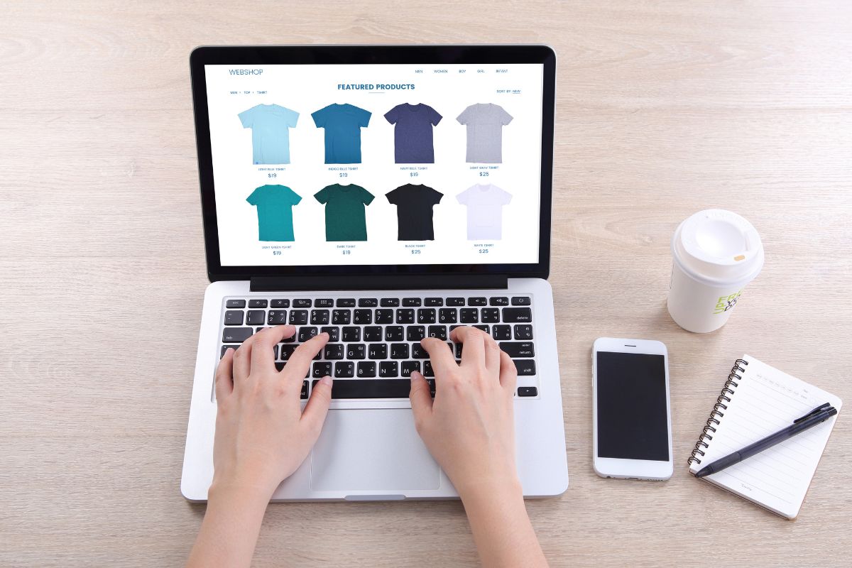 A man's hand setting the pricing of his products online.