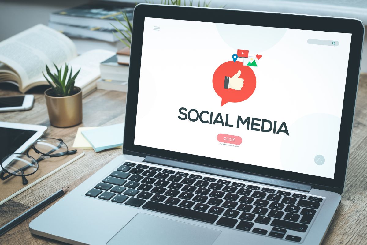 The picture of a laptop with social media apps.