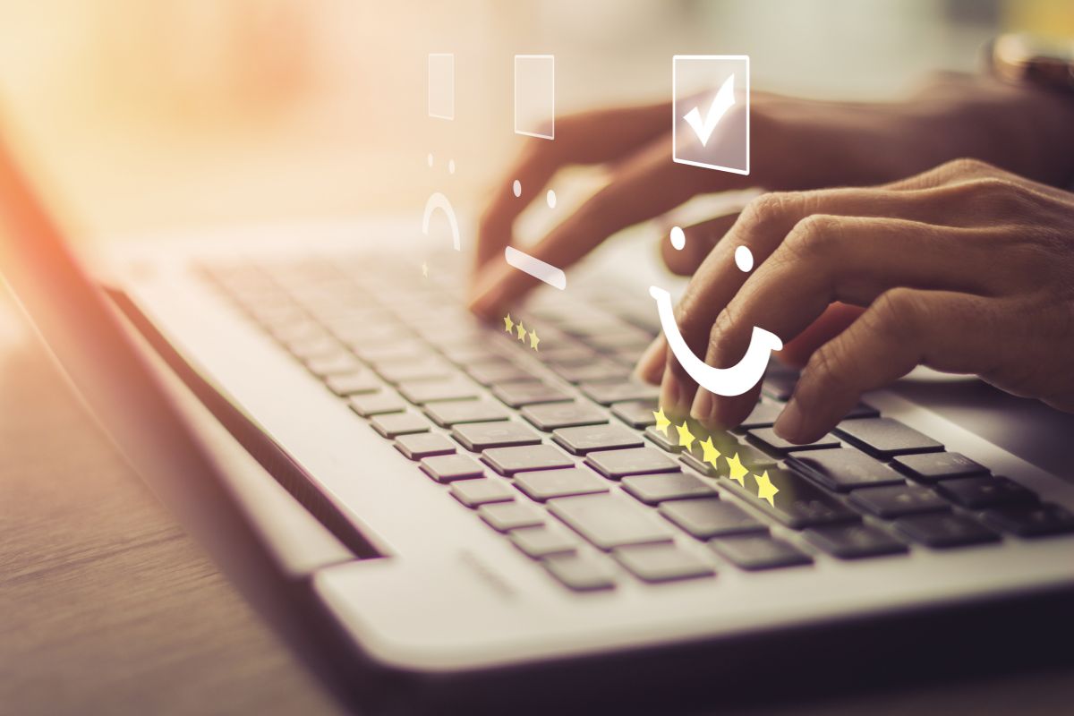 The picture tells about a girl's hand using a laptop with different rates of visual displays which refers to handle customer service keeps buyers happy and brings in repeat business.