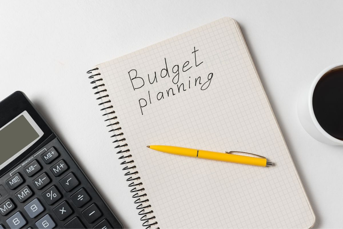 Image of a notebook with budget planning wording. 