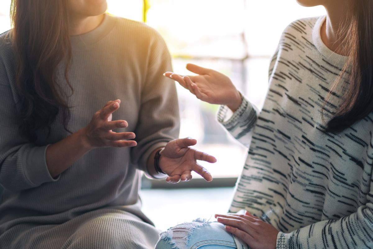 The image tells of two girls talking to each other, which means seeking accountability from a friend who can provide a second opinion on whatever purchase is necessary.