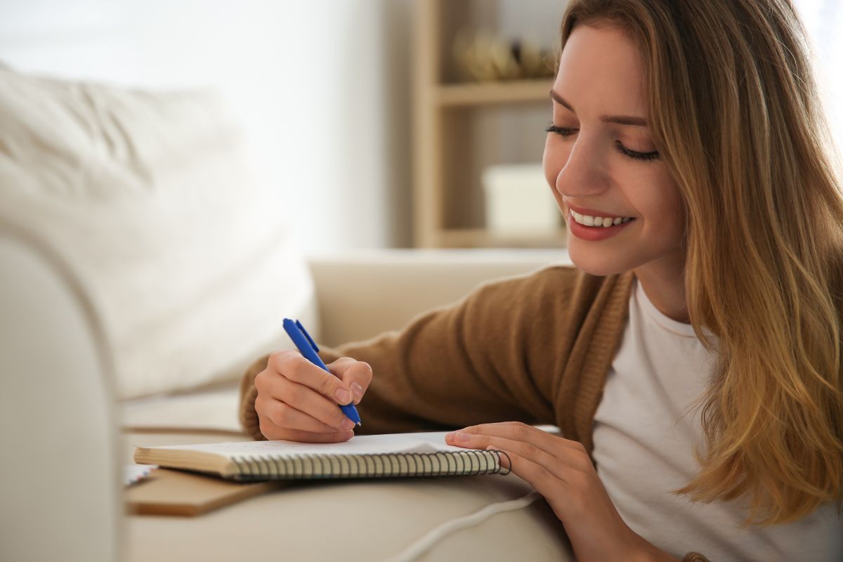 The picture of a woman writing letters.