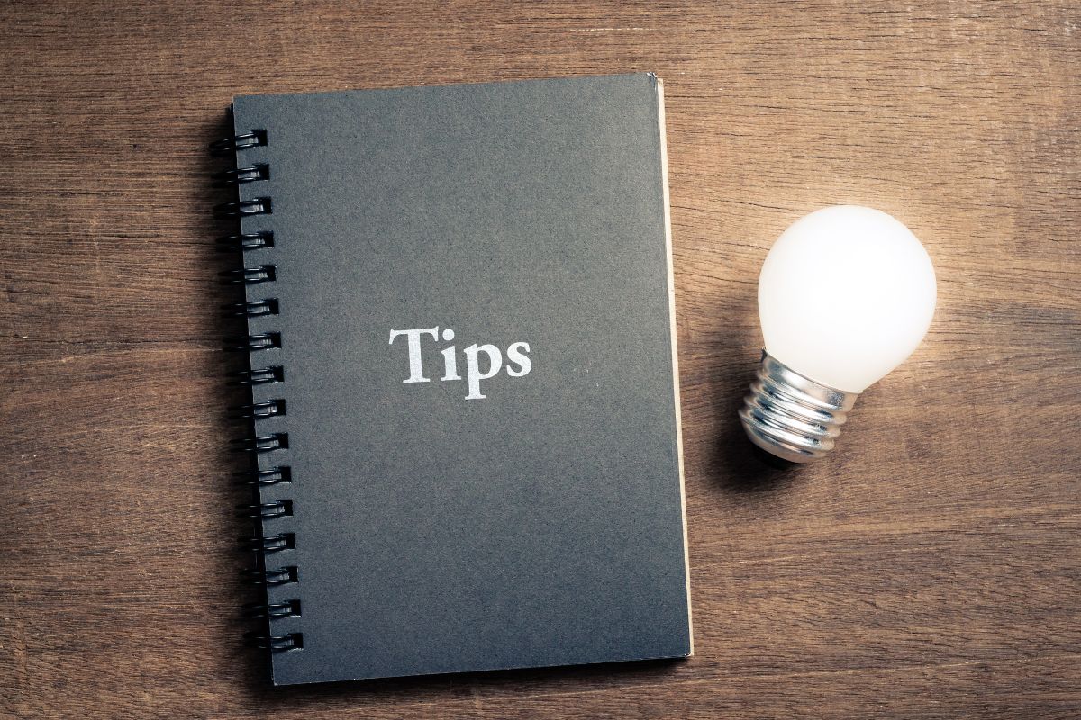 The image is about a notebook with tips wording.