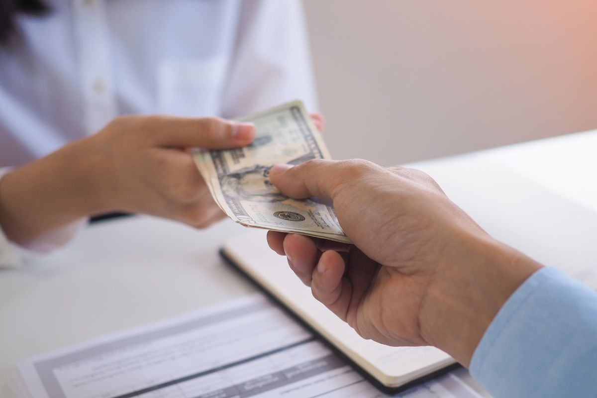 The image is using cash instead of credit card.