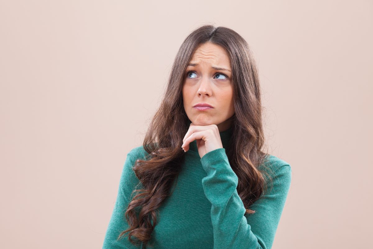 The picture shows a woman asking herself.
