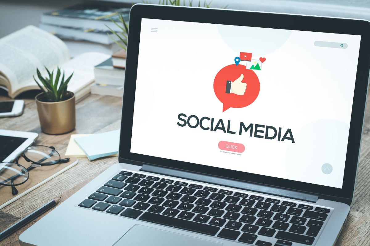 The picture shows a laptop with a social media display.