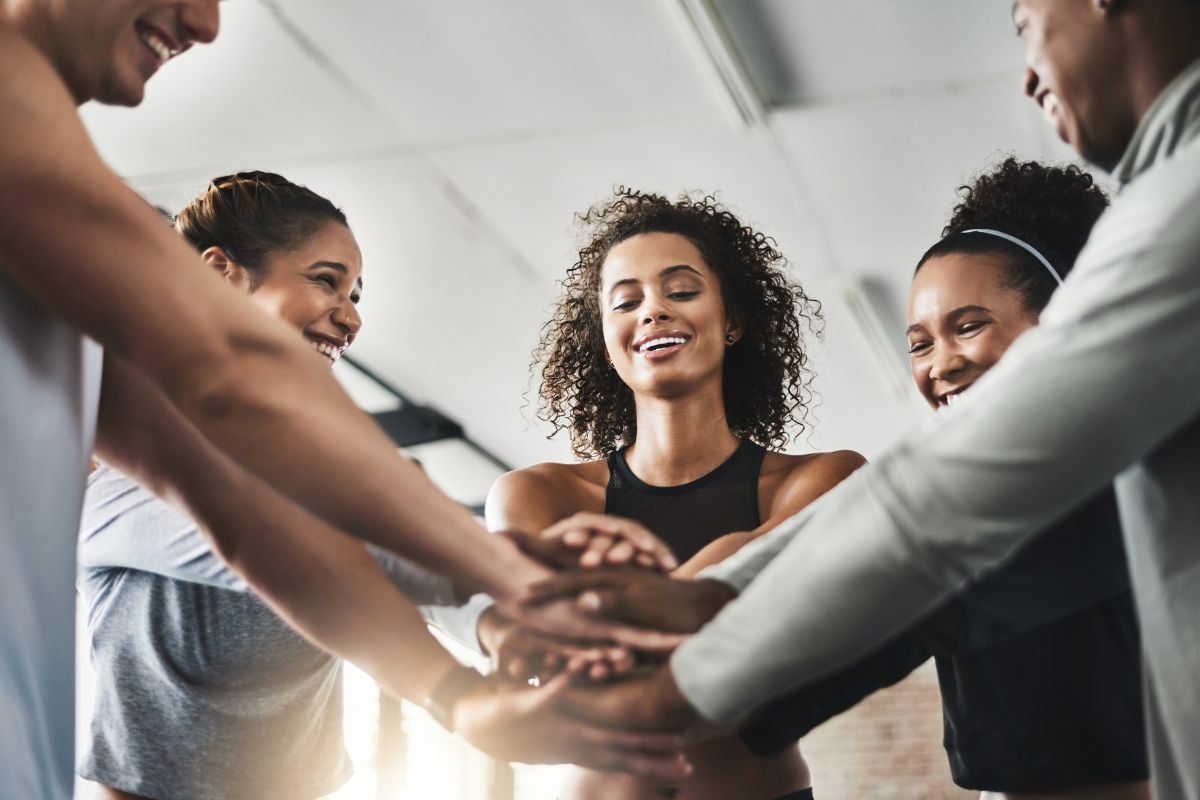 The photo shows a group of supportive people.