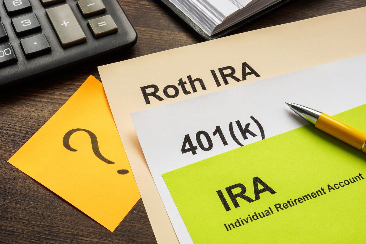 The image shows a calculator, a notebook, a pen, and papers with notes on the table indicating that taking advantage of tax-advantages accounts can create a strong financial future for your family.
