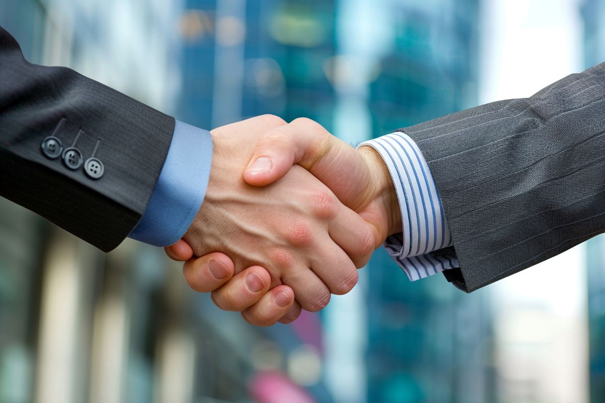 The picture of men shaking hands.
