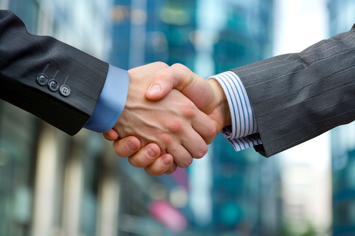 The photo tells about two hand shaking indicating to give back through mentoring helps build meaningful relationships and personal fulfillment.

