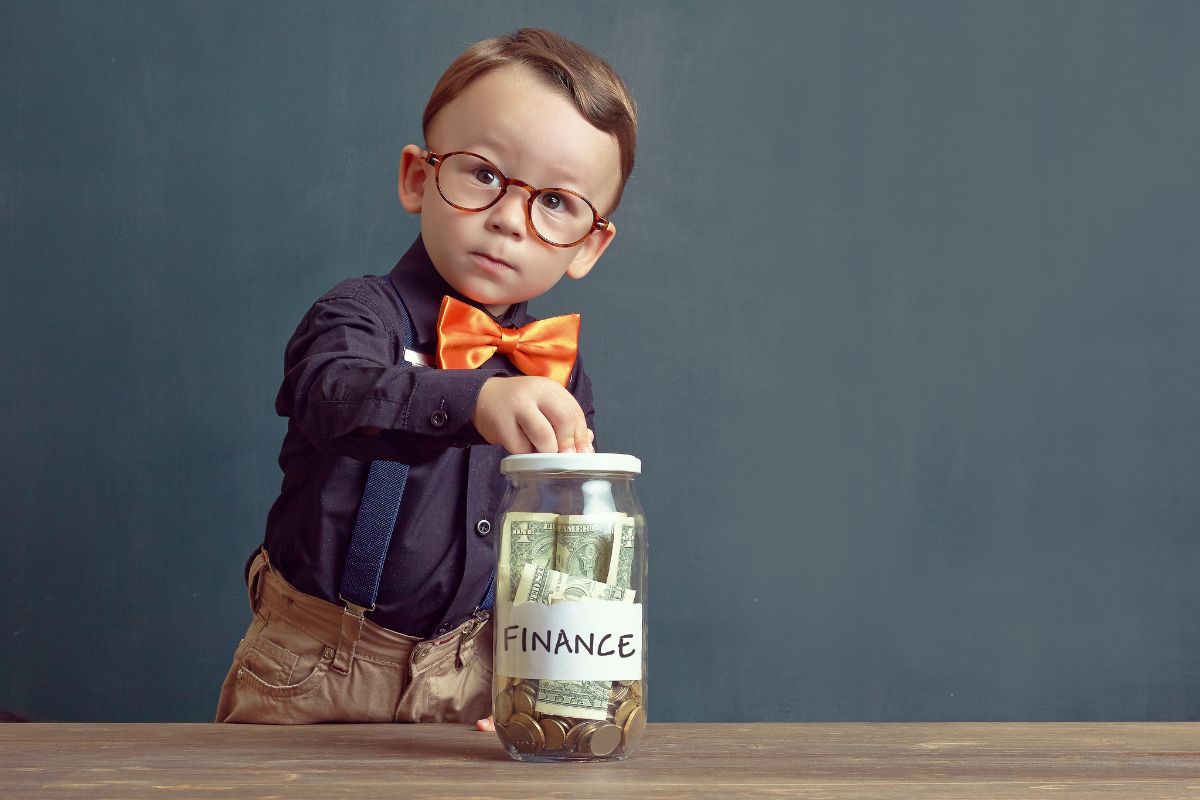 The picture shows a kid saving money.