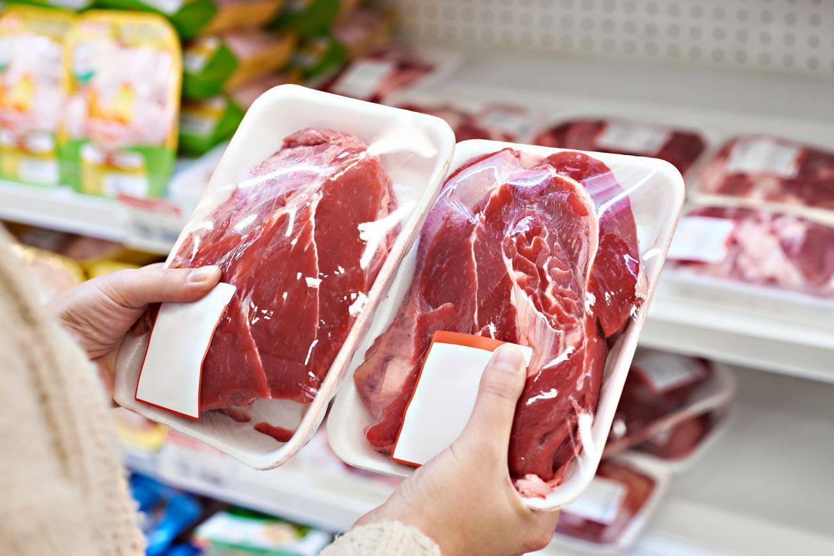 The image is about a woman purchasing whole cuts of meat.