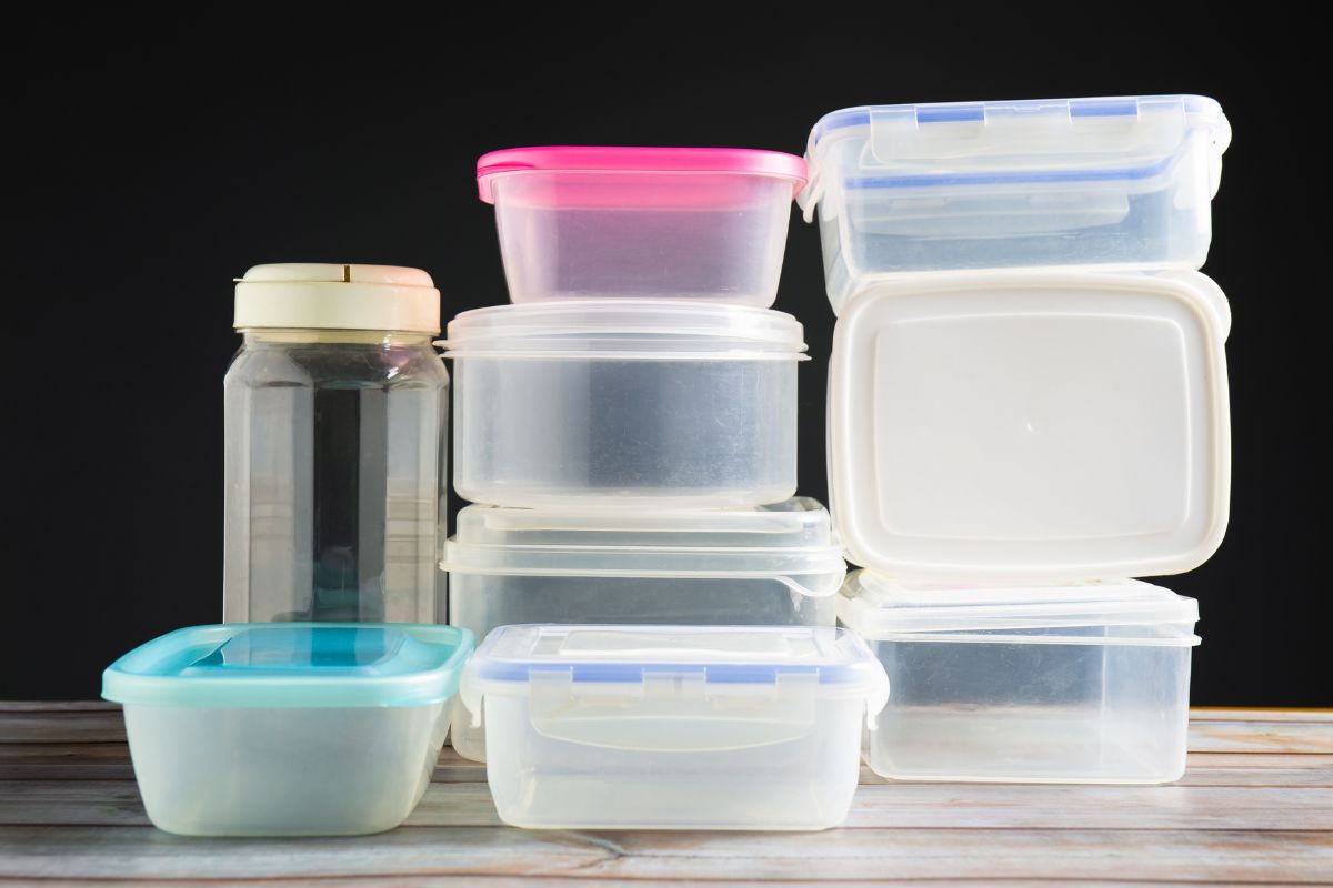 The photo shows plastic containers at the table which refers to purchasing high-quality reusable containers that help organize your kitchen and pantry.