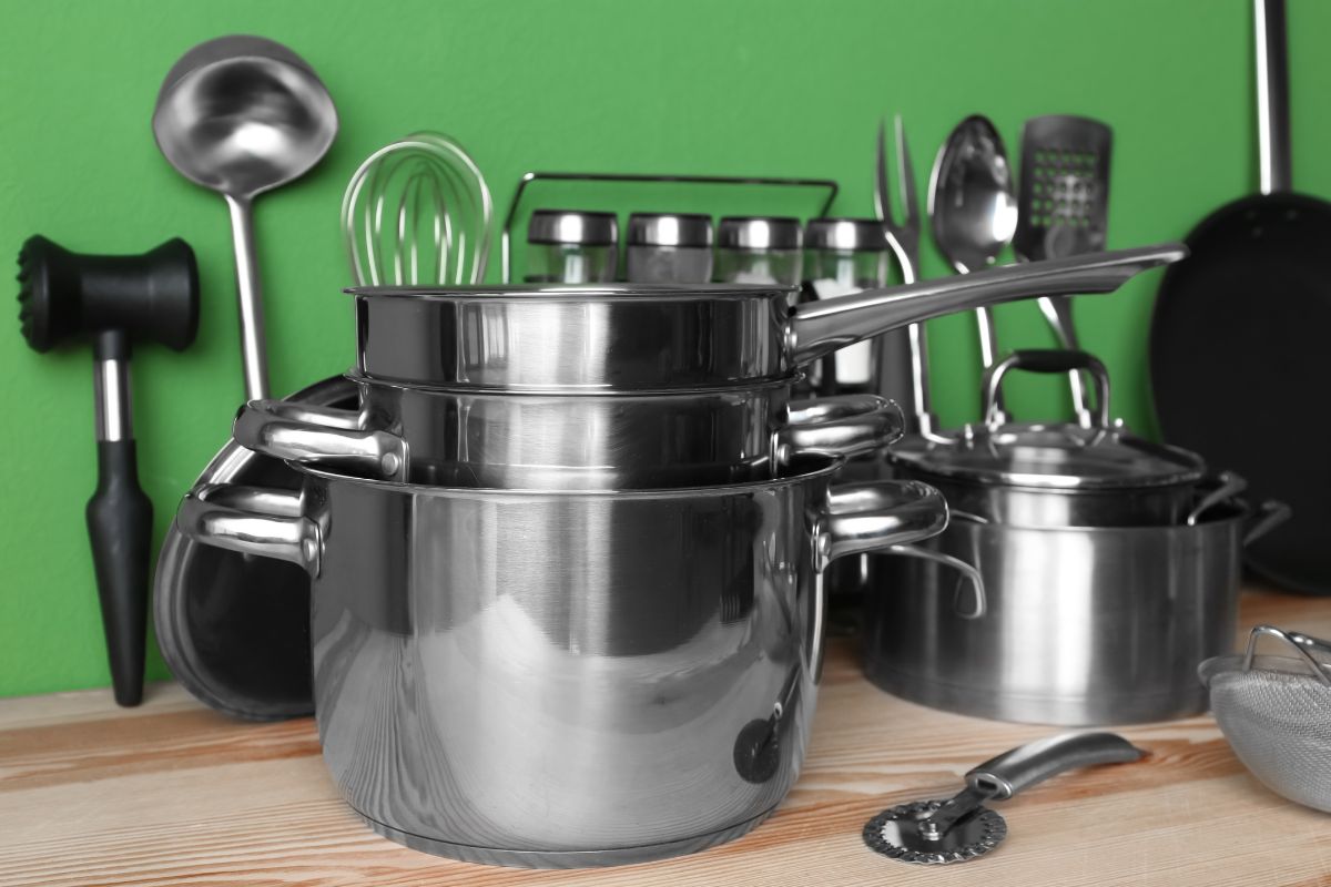 The image tells about different kinds of cookware and utensils on the table which means take advantage of local restaurant supply stores that can cost much less when bought in larger amounts.
