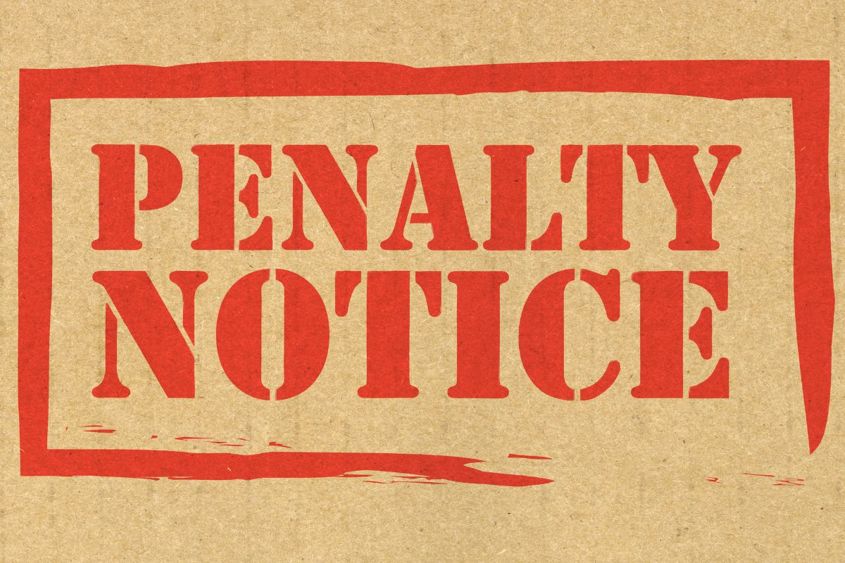 The image shows a paper with a penalty notice.
