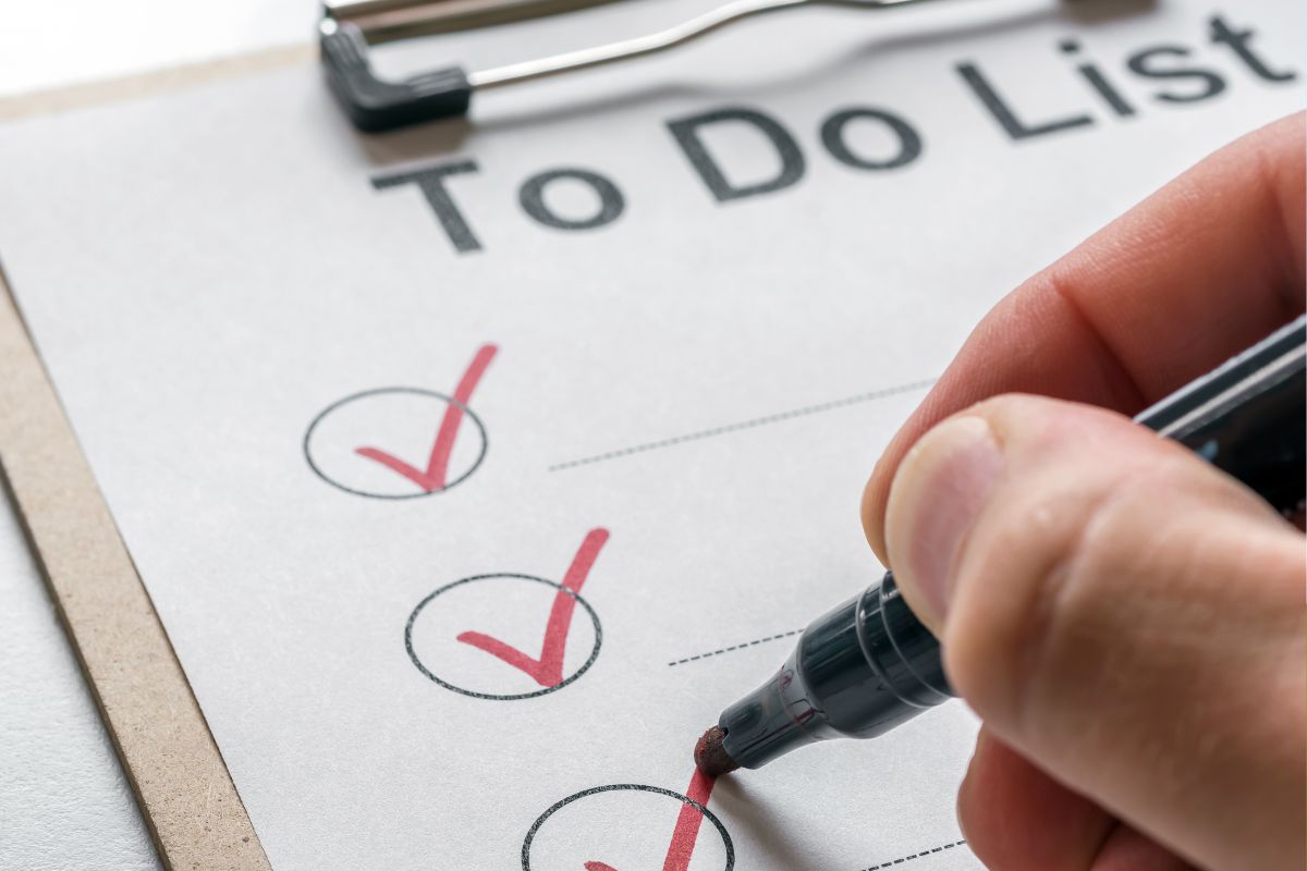 The picture shows a man's hand doing a reverse to-do list.