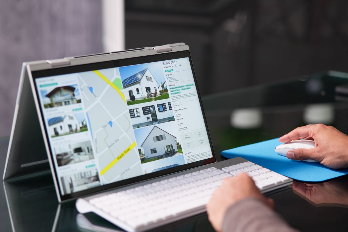 The image is about a man's hand selling digital land.