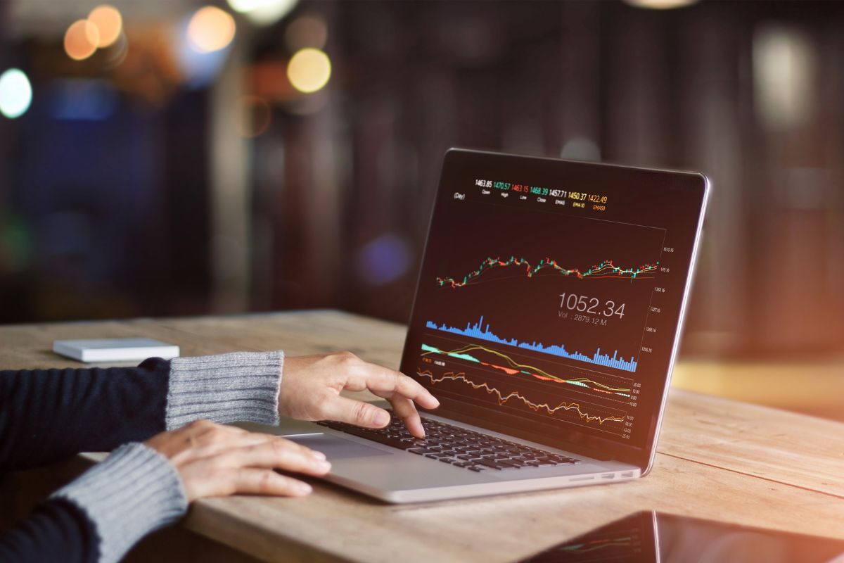 The photo shows a man trading stocks.