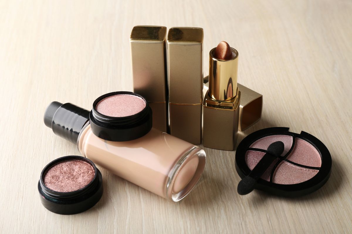 The photo shows cosmetics at the table referring to high-end beauty products that often drive up prices, drugstore brands often work just as well for a fraction of the costs.
