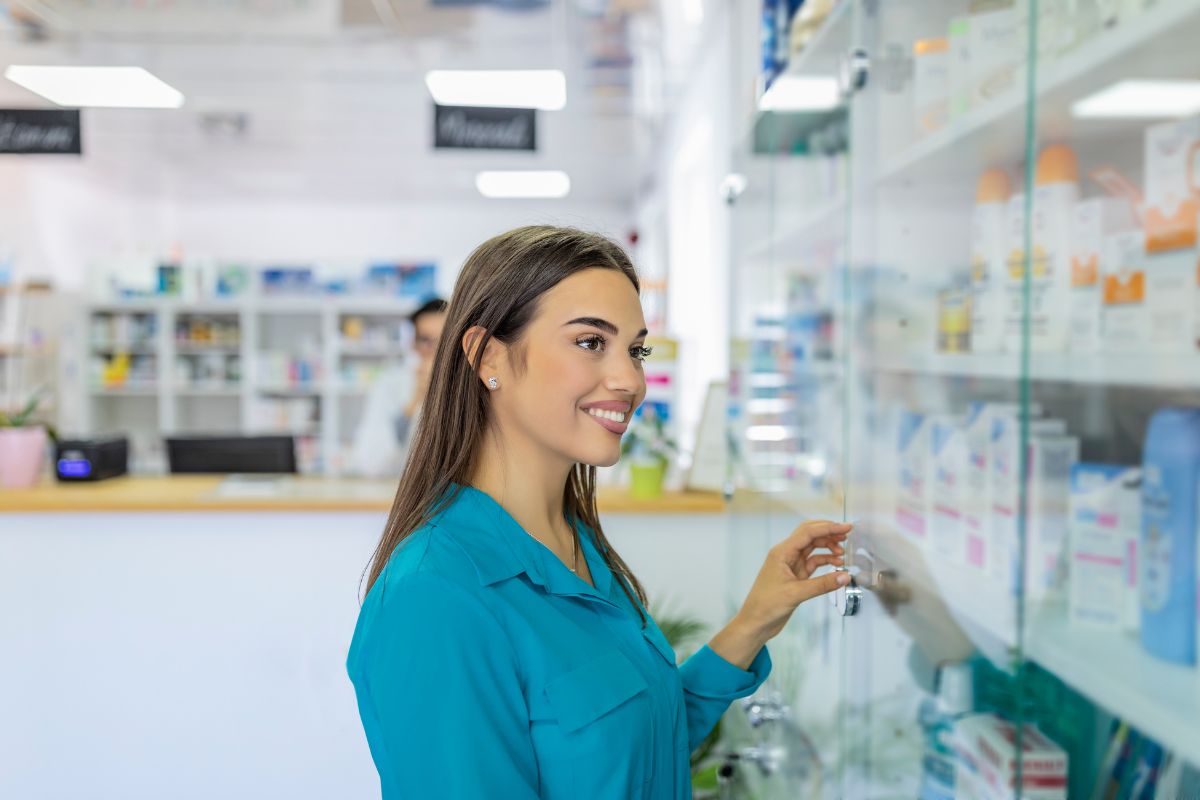 The image tells about a girl picking up medicines in a store which means brand-name medications cost more than generics, checking different pharmacies can also help find better prices.