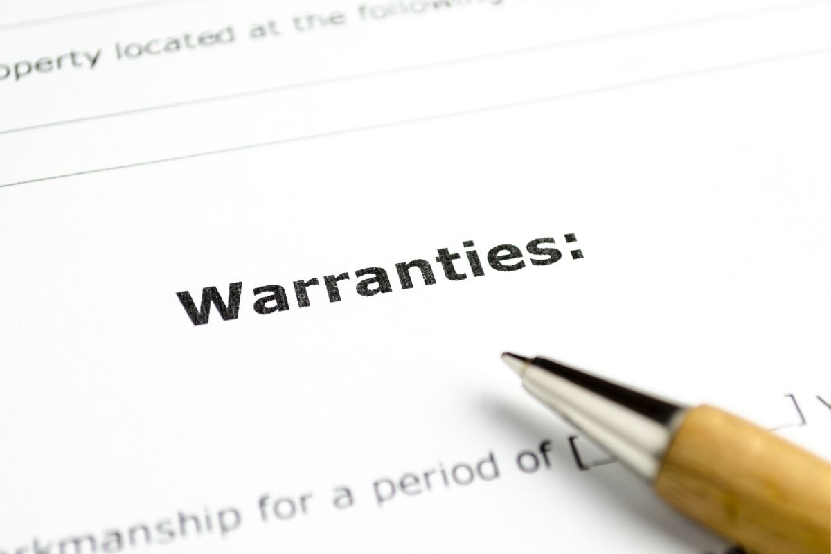 The photo shows a paper with warranty wording.