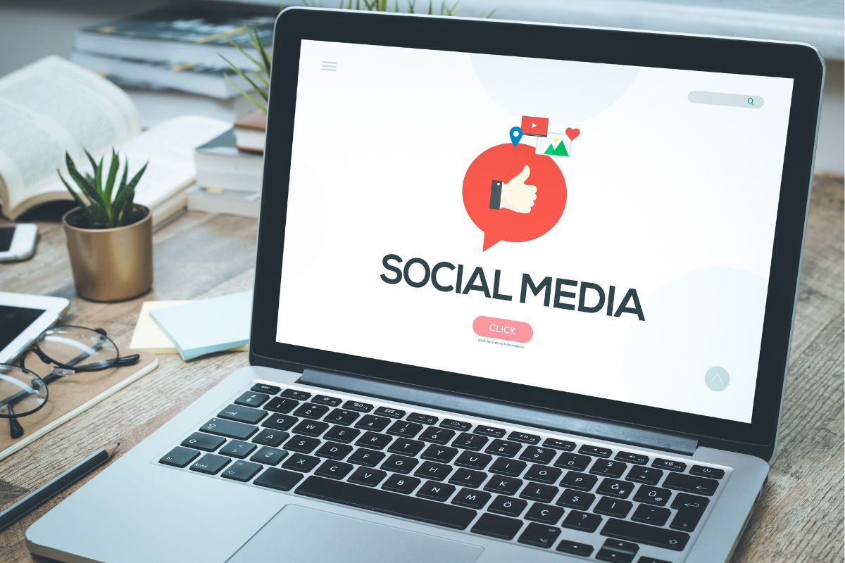 The picture shows a laptop with social media wording.