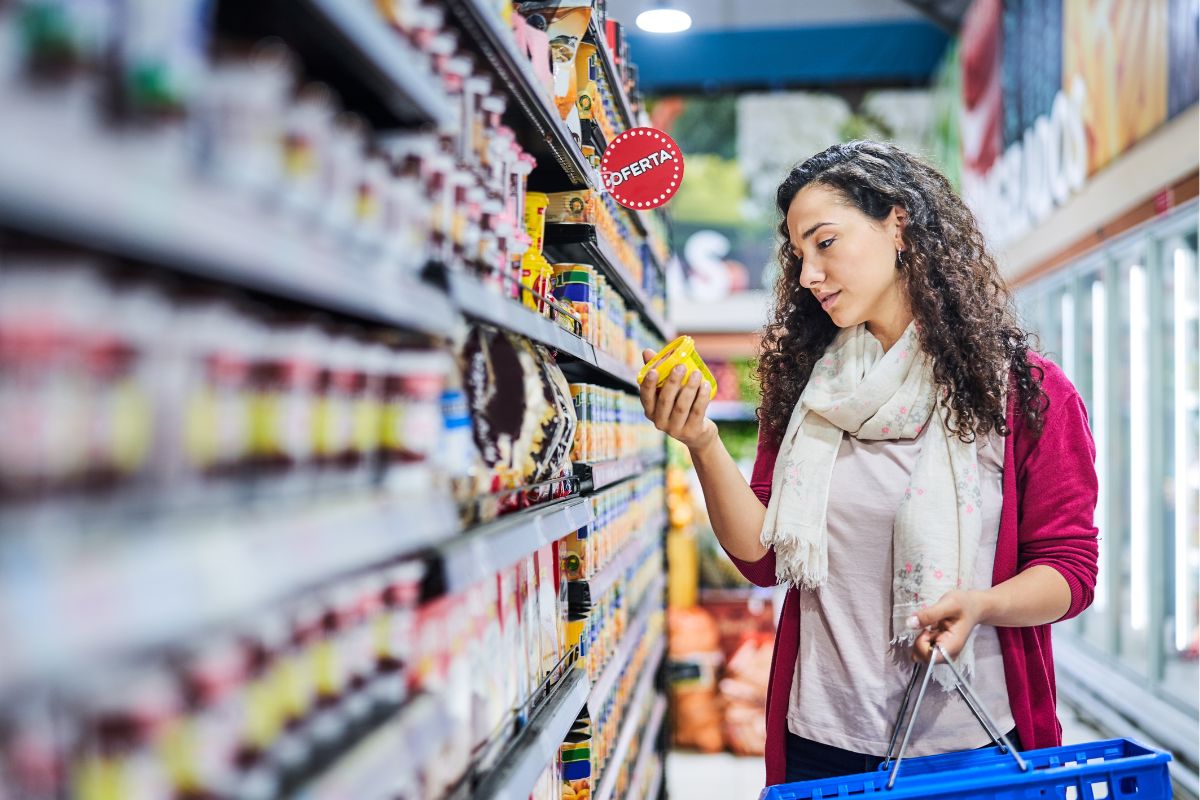 The picture of a woman buying full-priced items.