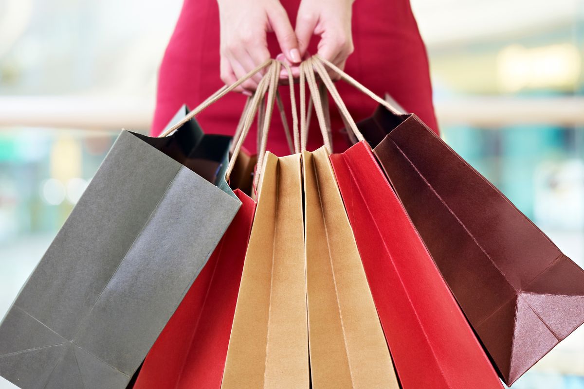 The picture shows a woman's hand living in a lifestyle inflation.