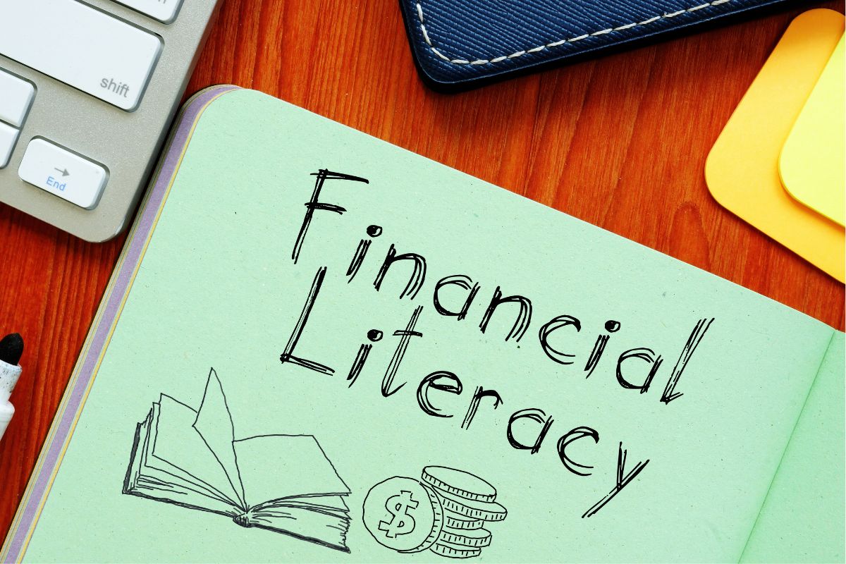 The photo shows a paper with financial literacy wording.