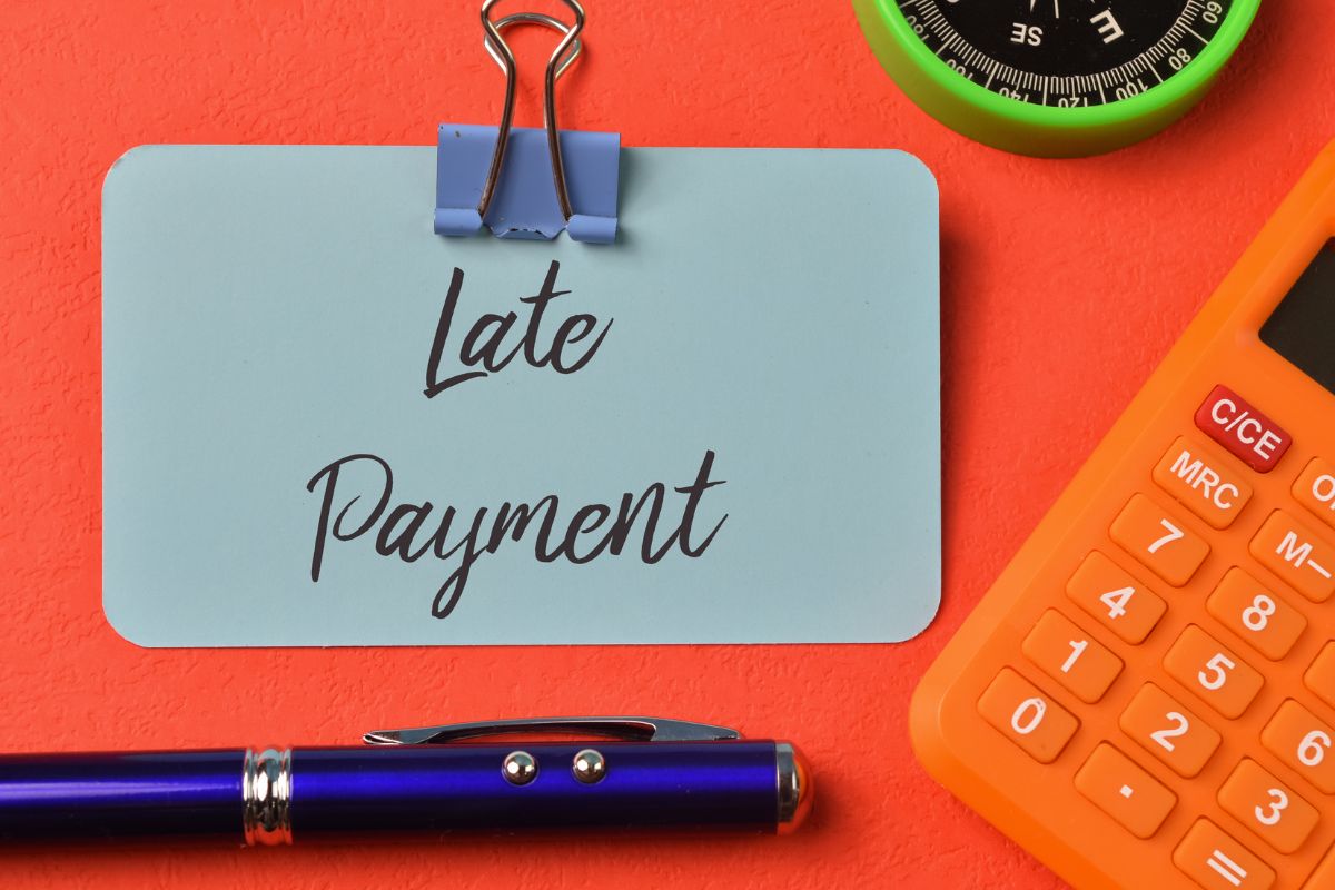 The image shows a paper with late payment wording.