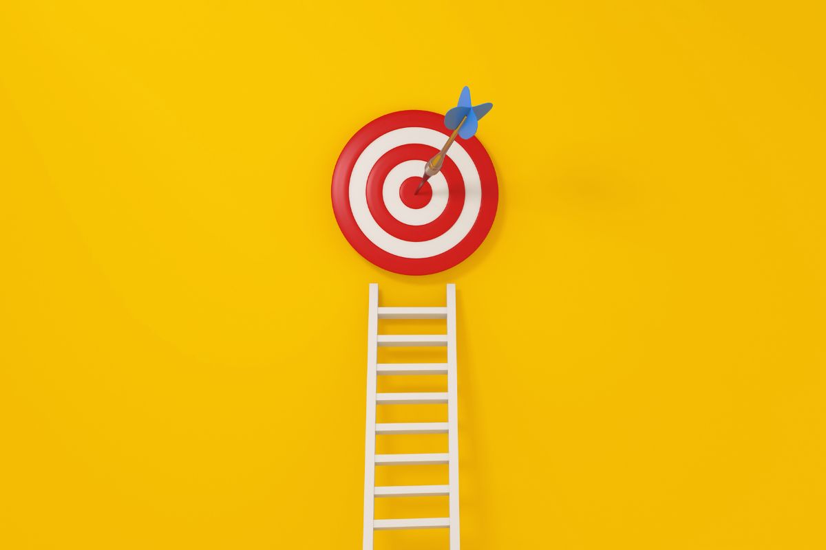 The image tells about a stare, a target circle, and a sharp object which means the goal is living life on your terms where you have choices and control.