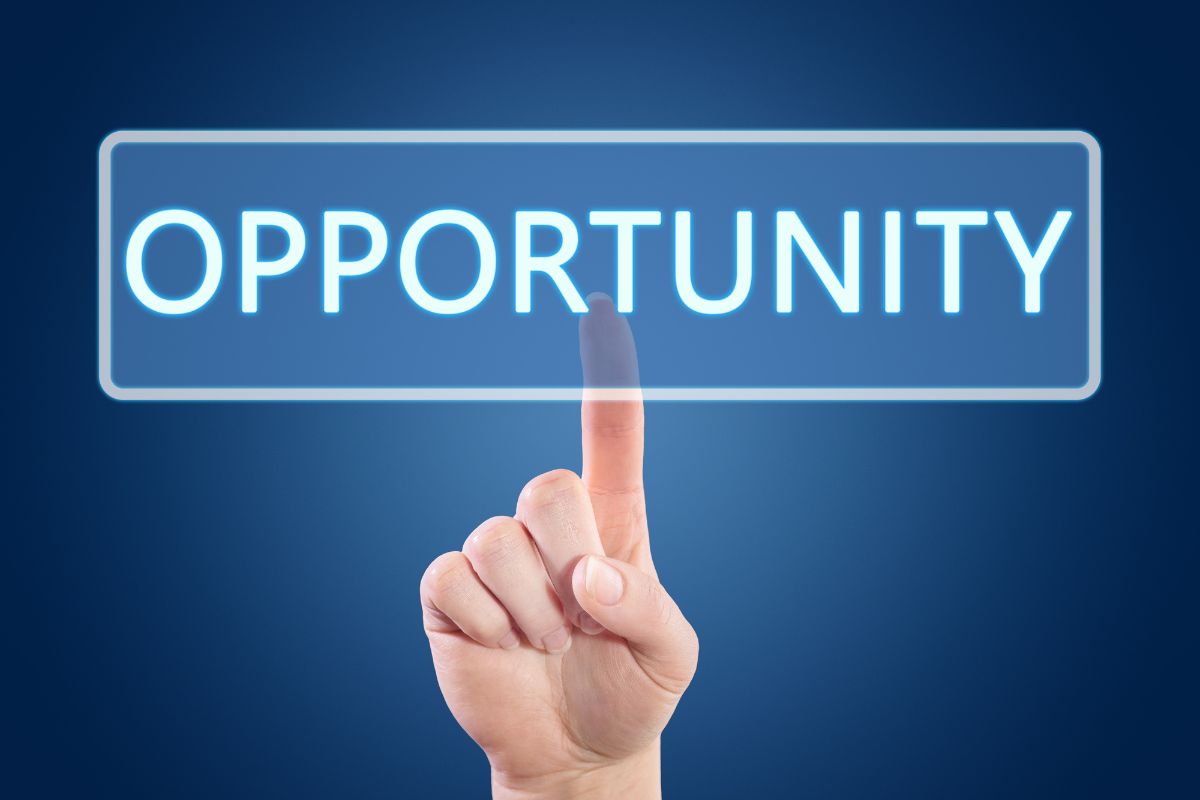 The image tells about a man's hand pointing the visual note on the screen which means the opportunity is missed by most people and that wealth is built through smart decisions, persistence, and hard work.