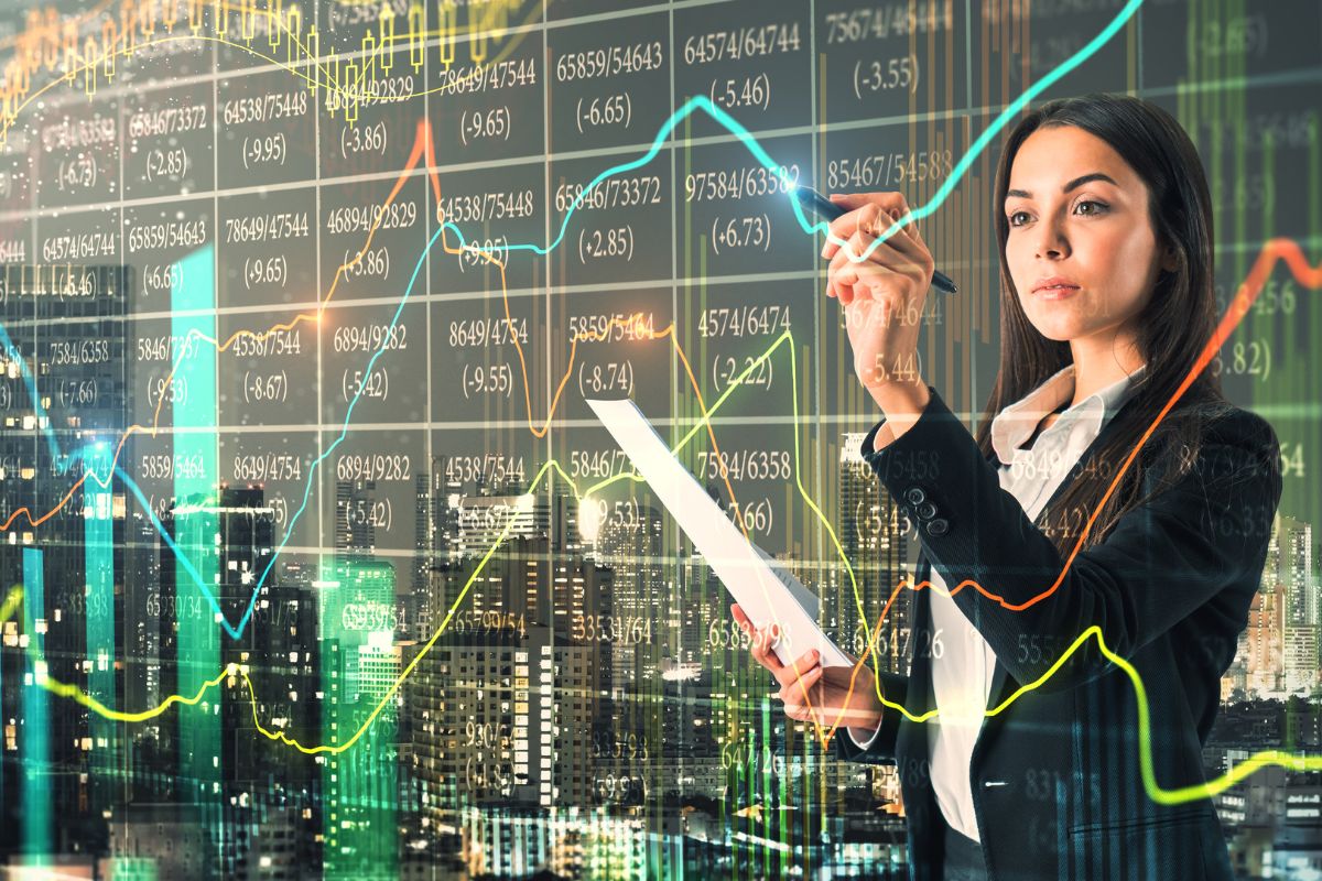 The image shows a woman working as a quantitative analyst.
