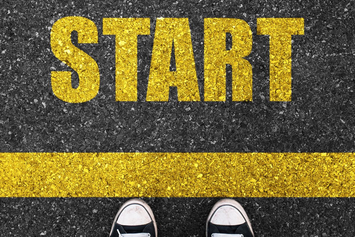 The picture shows a road with a note and shoe which refers to the secret to getting ahead is getting started, taking the first step today puts ahead of those who never try.