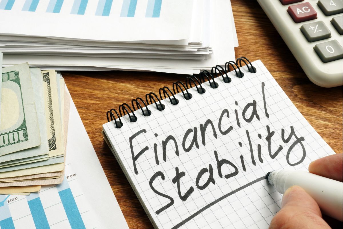 The photo shows a paper with financial stability wording.
