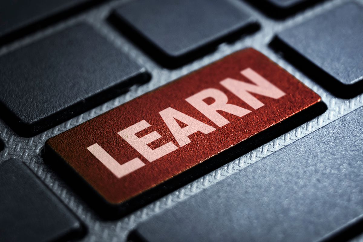 The picture of a keyboard with learn text.